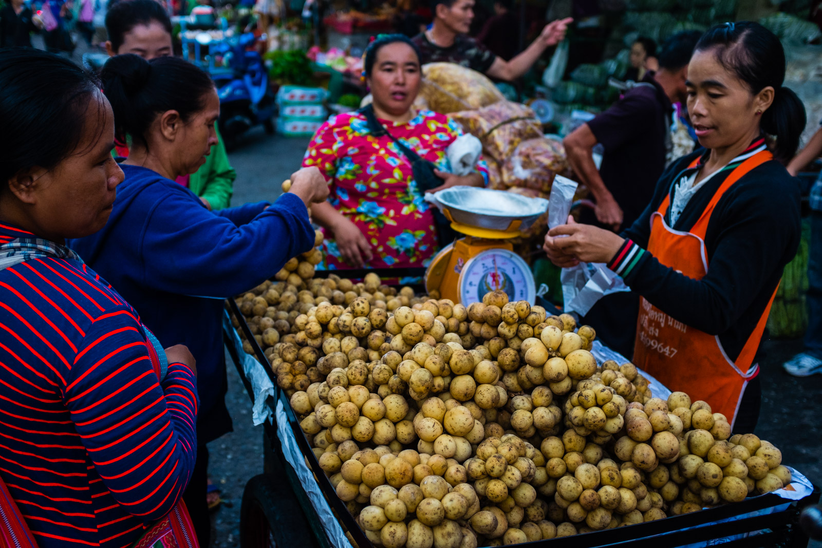 Women buying fruit